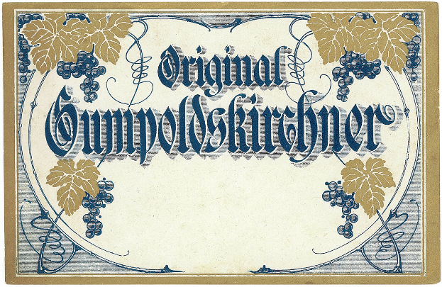 Ein altes deutsches Weinlabel mit einer Illustration von Trauben und Blättern, auf dem der Weinertyp angegeben ist.