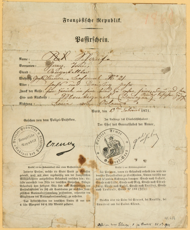 Ein altes, gelbliches Dokument mit einem kreisförmigen, schwarz umrandeten Stempel, das schwarze Tintentext enthält, wahrscheinlich ein Brief der deutschen Regierung.