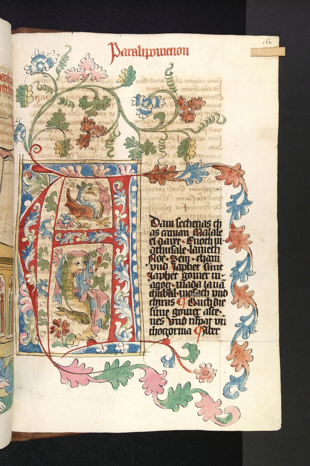 Ein aufgeschlagenes Buch mit einer illuminierten Handschrift mit floralem Design und Text, gefüllt mit leuchtenden Farben und detaillierten Elementen.