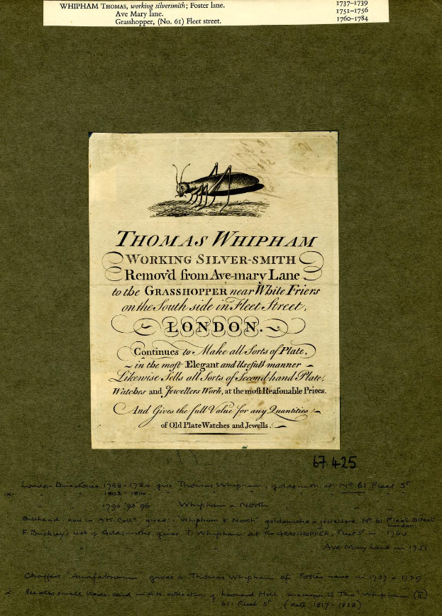 Ein altes Buch mit einer Zeichnung eines Grashüpfers auf dem Cover, mit Text auf den Seiten.